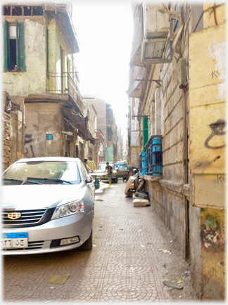 Car in narrow lane.