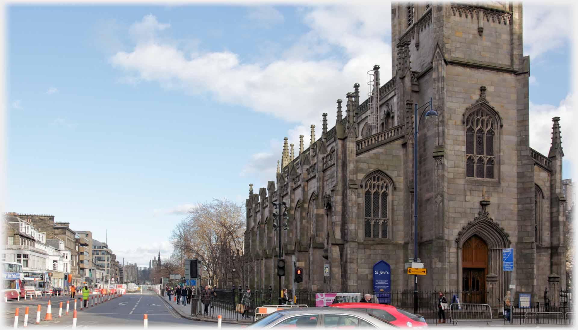 Church with road stretching away beside it.