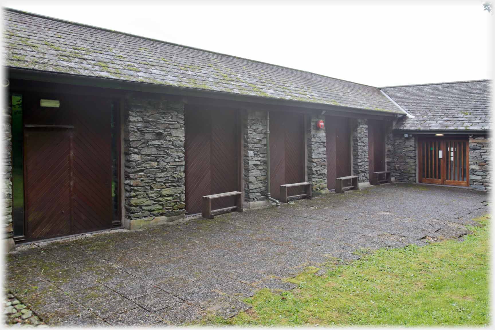 Building in dark stone and slate.