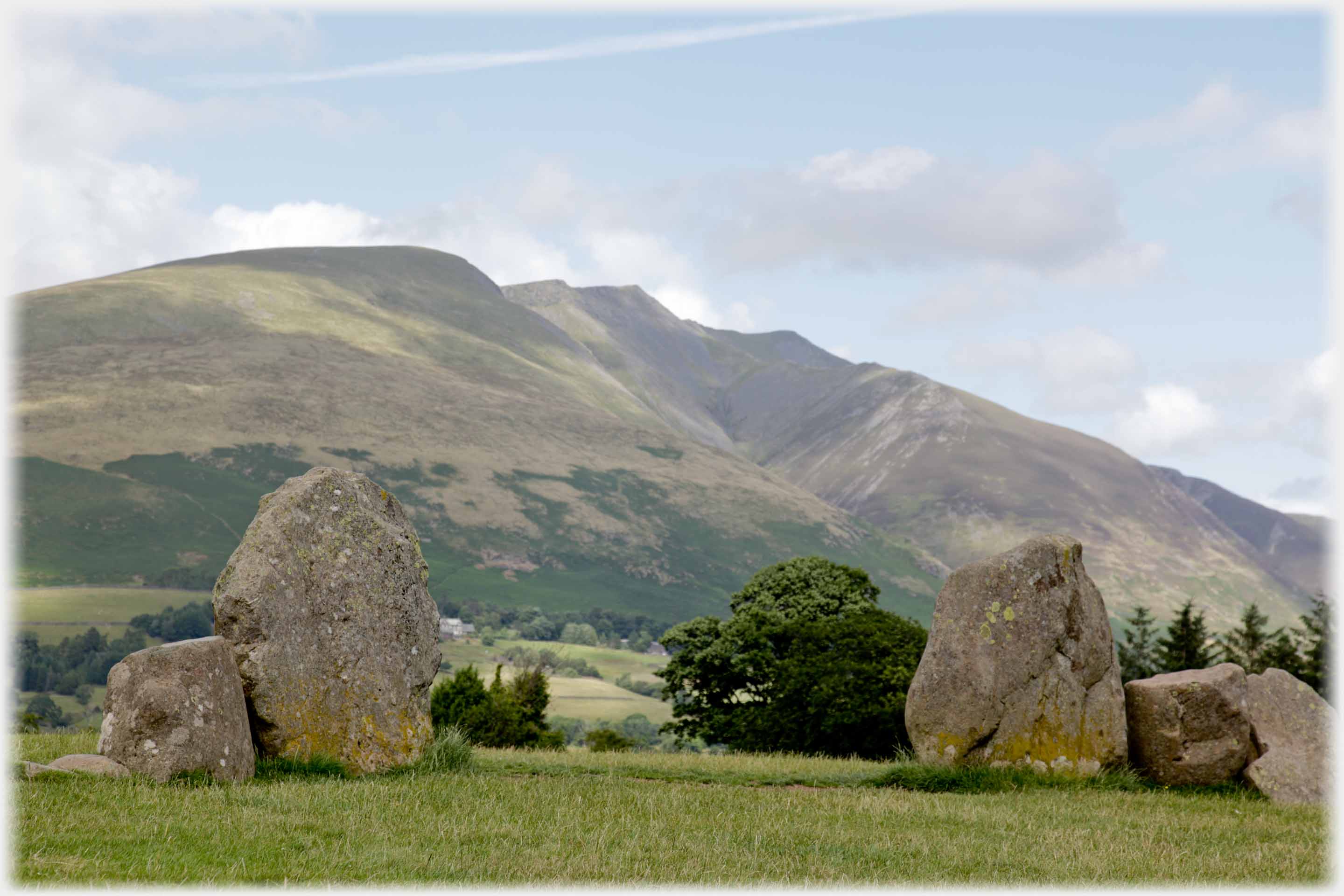 Repeat shot of the two big stones but from other side showing them framing the mountain.