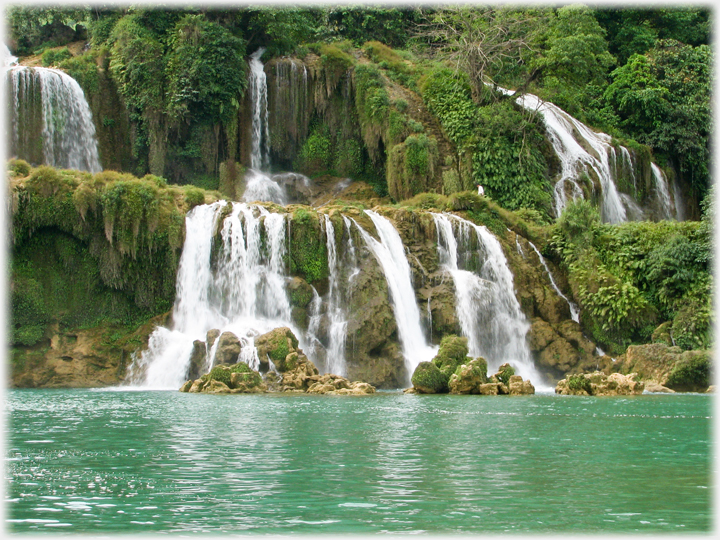 Section of the cascades with turquoise coloured lagoon in front.