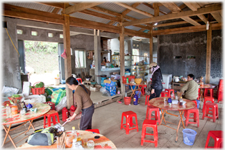 Cafe interior, woman cleaning.