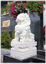 Marble lion outside hotel.