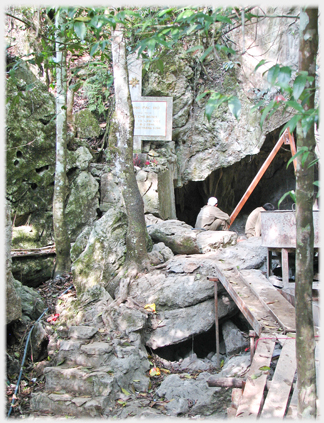 Rocky area with black hole, steps, bords and workman.