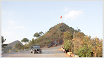 The hill and Vietnamese flag at the northern tip of Vietnam.