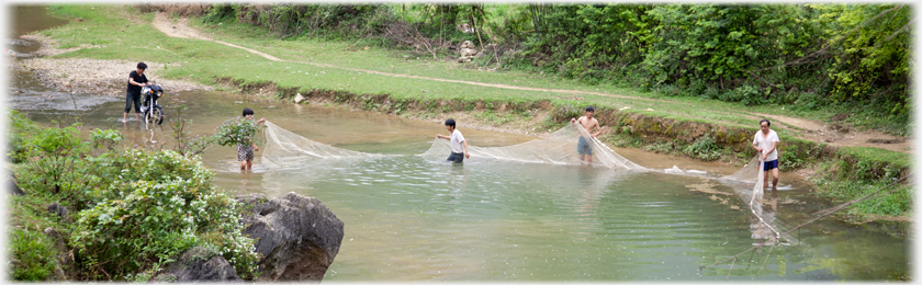 Net being taken out across the river.