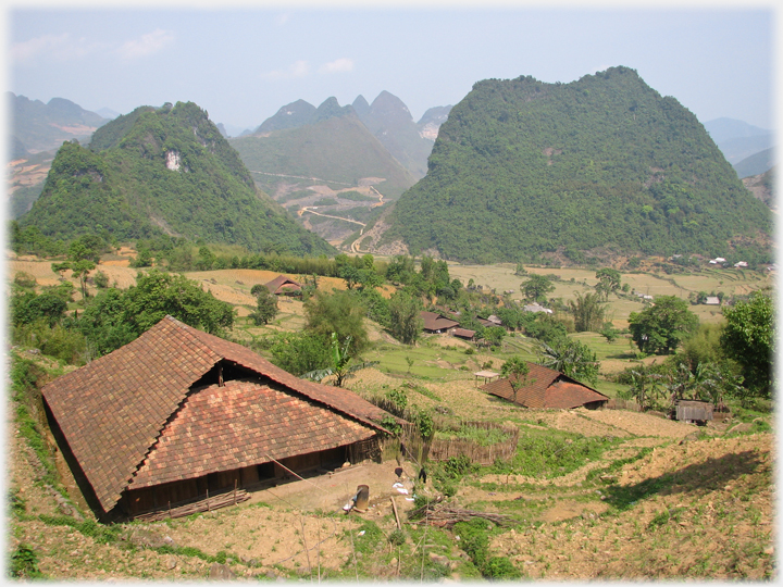 Large houses with tiled roofs.