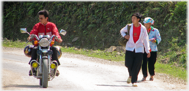 Motorbike with Han, and pedestrians.