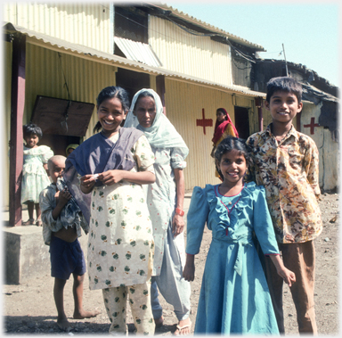 A woman and children in front of the clinic.