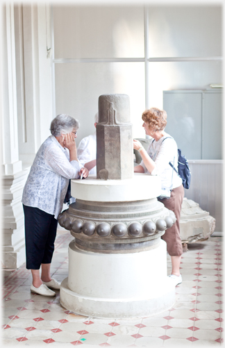 Visitors with lingam.