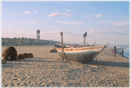 Boat on beach held upright.