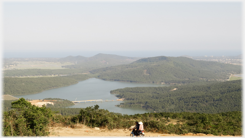 View from near the hilltop of the country stretching down to the sea and the town of Tinh Gia.