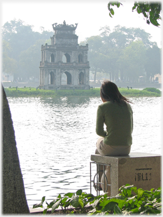 Woman sitting by the Lake