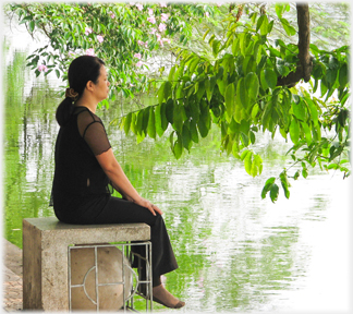 Woman under trees