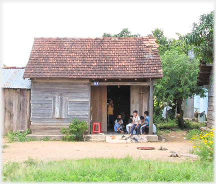 Small house with children gathered.