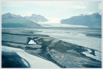 Water flowing out from the glacier beyond.