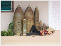 Sleeper beside bombs.