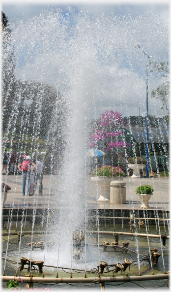 Fountain with lamps at the base.