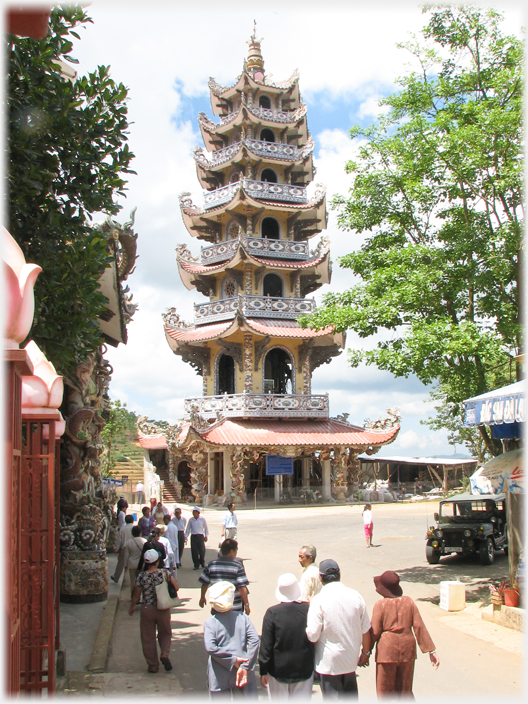 The main bell tower with visitors on the road below.