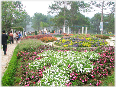 Richly planted flower beds.