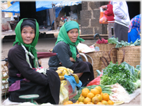 Two women with their produce.
