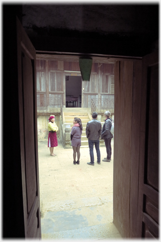 Group seen through doorway.