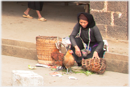 Woman with hens.