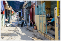 Central road with householders relaxing.