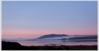 Sunrise catching hill cloud and sea