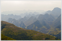 Landscape of cone-shaped mountains.