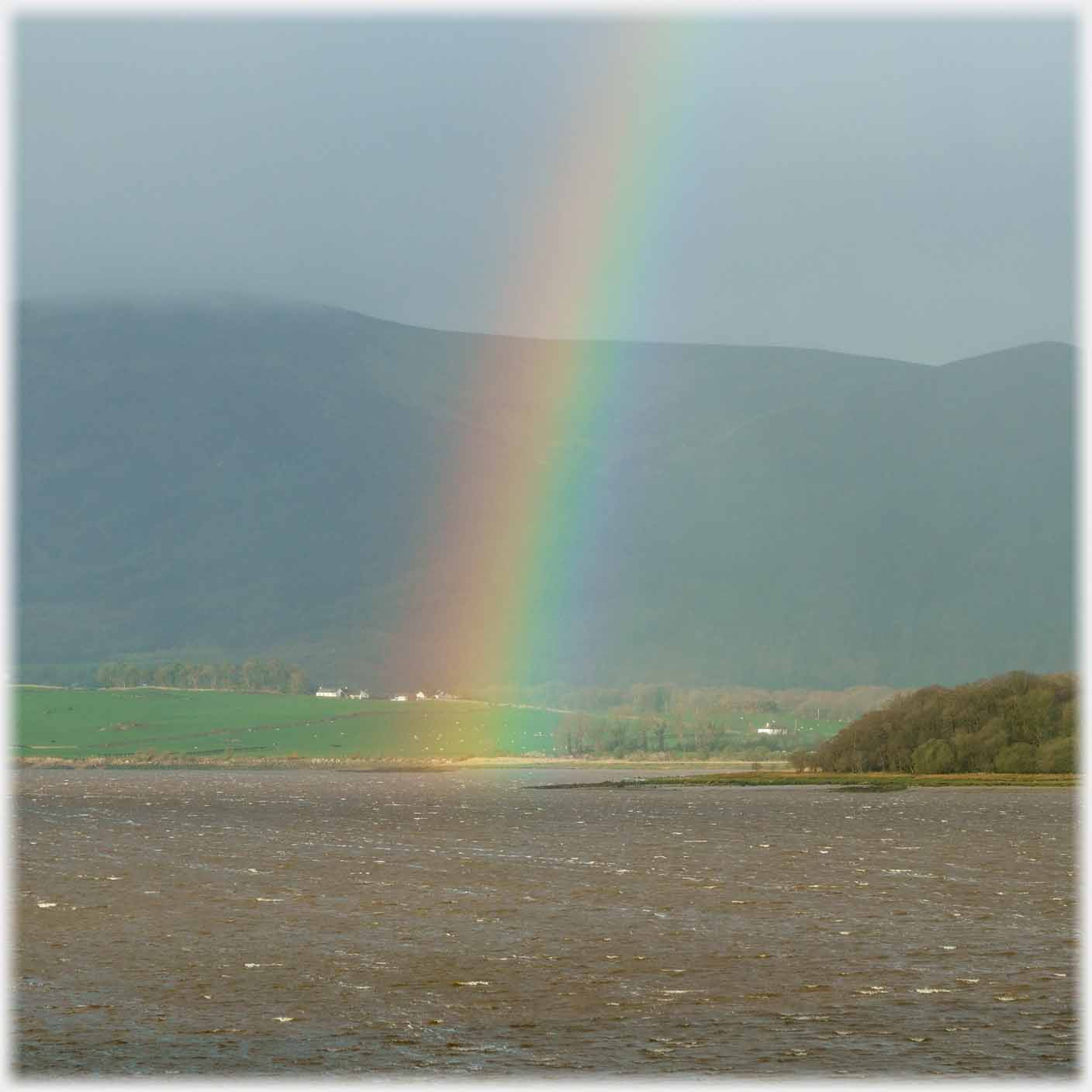 Rainbow into sea.