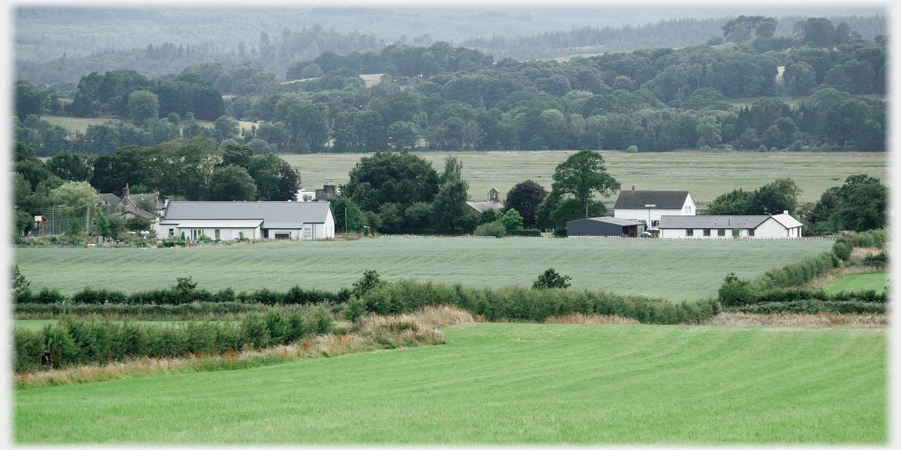 Two building across fields.