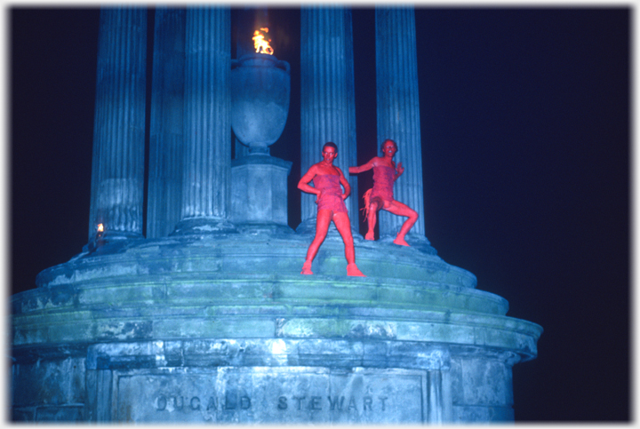 Two lightly clad red figures on the Stewart monument.