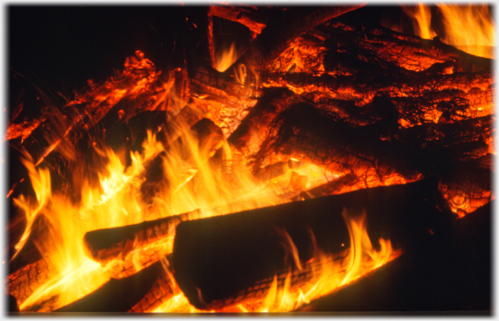 Logs burning at the heart of the bonfire.