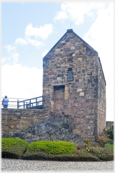 Looking up at the end wall of the Chapel clearly sitting on bedrock.