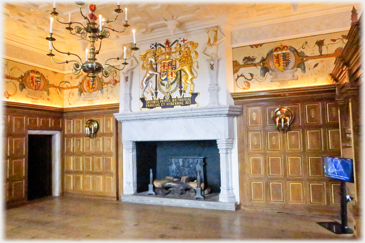 The Laich Hall with its large fireplace surmounted by the royal coat of arms.