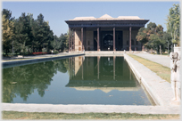 Palace building with pool in front.