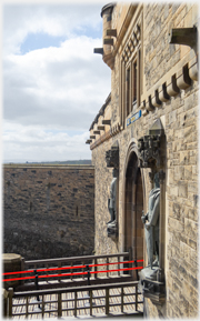 Side view of statues and entrance bridge.