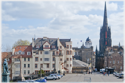 Four story building and spired church.