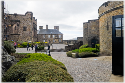 Cobbled area between buildings and walls.