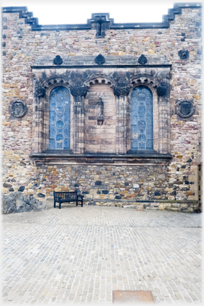 Two windows in end wall of building.