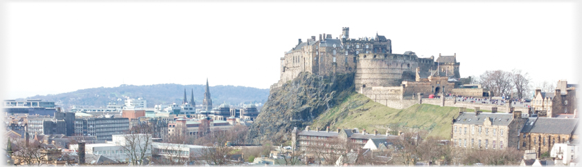 Castle to right Cathedral spires and hill to left.