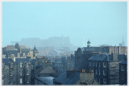 Castle disappearing in snow.