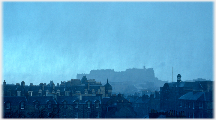 Passing ragged edges of snow clouds.