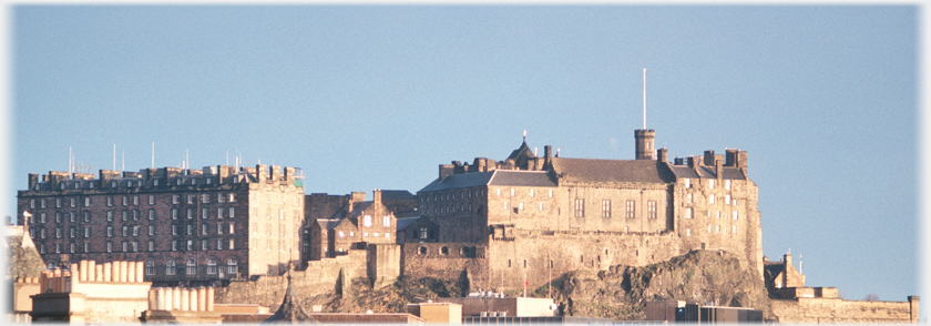 South side of castle lit, west side in shadow.