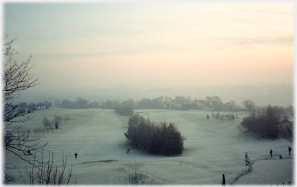 Golf course with mowen lines and Arthur's Seat centrally.