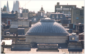 Dome with clutter of roofs around it.