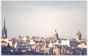 Roofscape with done, spire and tower.