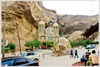 Front of church built into hillside.