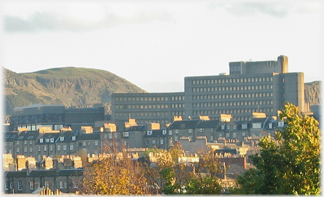 Great block of brutalist building and Arthus Seat.